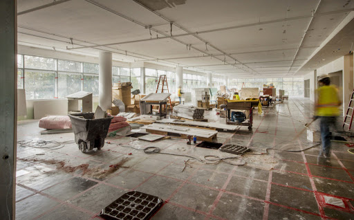 Workers finishing tenant improvements in a new office building.